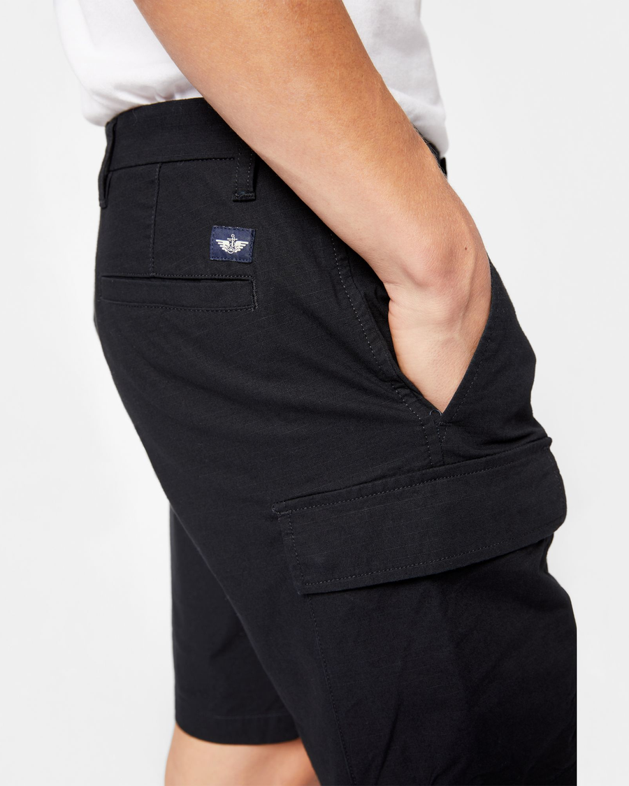 View of model wearing Mineral Black Smart 360 Tech Cargo 9" Shorts (Big and Tall).