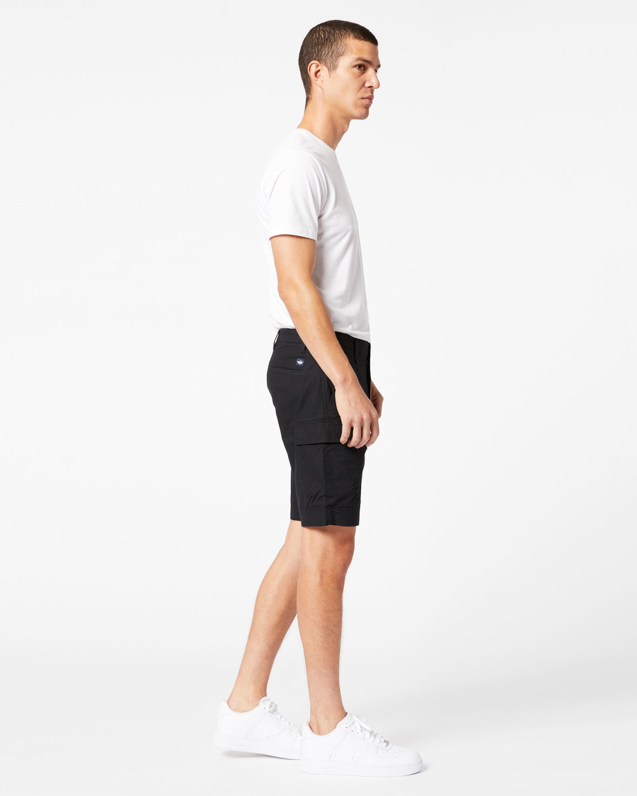 Side view of model wearing Mineral Black Smart 360 Tech Cargo 9" Shorts (Big and Tall).