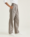 Side view of model wearing Mole Grit Original Pleated Khakis, High Wide.