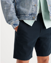 View of model wearing Navy Blazer Alpha 8" Shorts.