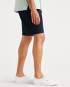 Side view of model wearing Navy Blazer Alpha 8" Shorts.