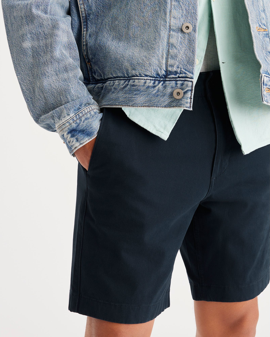 View of model wearing Navy Blazer California 8" Shorts.