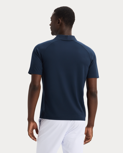 Back view of model wearing Navy Blazer Go Polo, Regular Fit.
