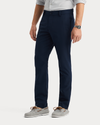 View of model wearing Navy Blazer Go Pro Pant with AceFlex, Slim Fit.