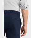 View of model wearing Navy Blazer Go Pro Pant with AceFlex, Slim Fit.