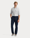 View of model wearing Navy Blazer Go Pro Pant with AceFlex, Slim Fit.