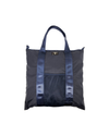 Front view of model wearing Navy Blazer Packable Tote.