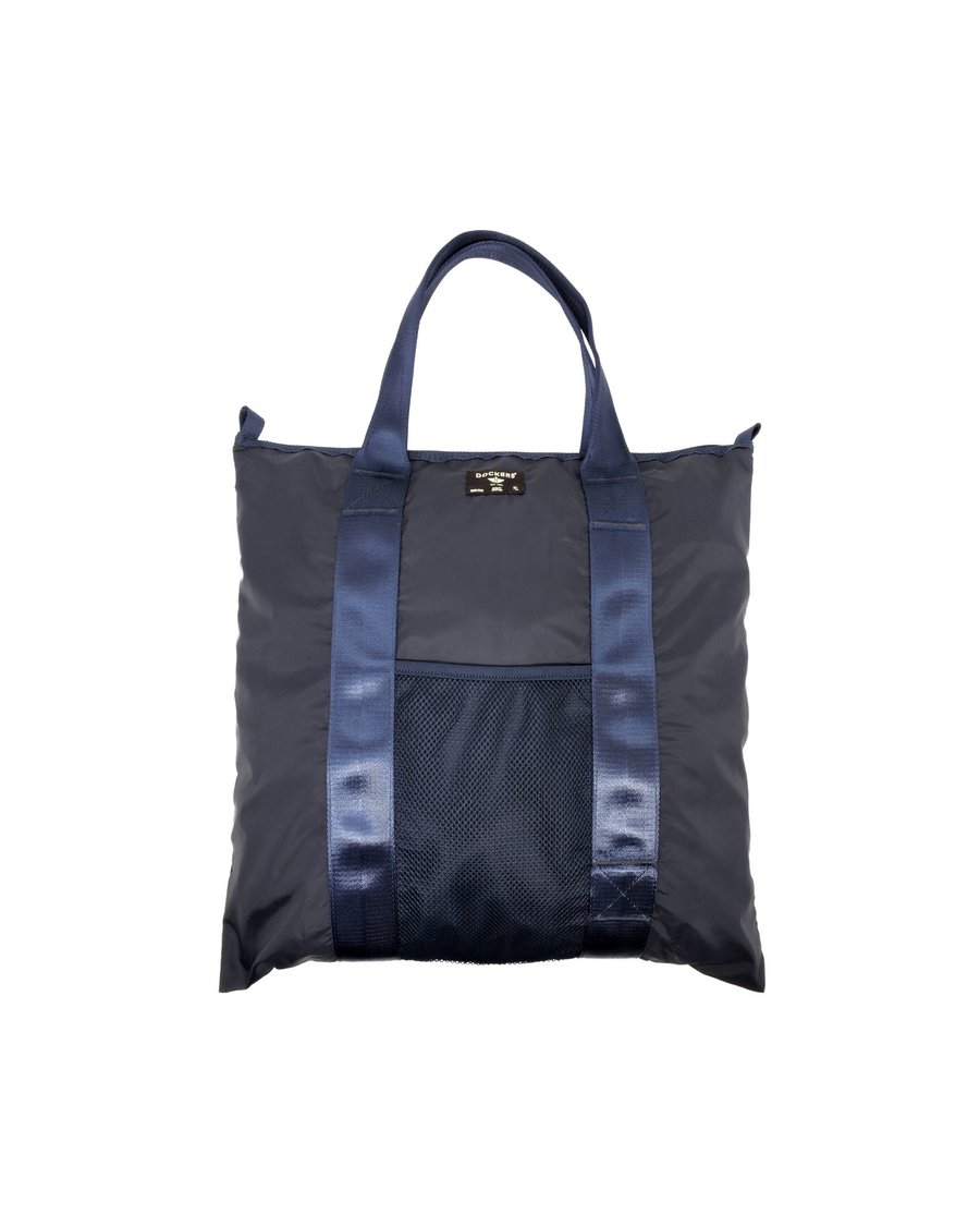 Front view of model wearing Navy Blazer Packable Tote.