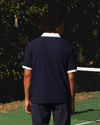 View of model wearing Navy Blazer Racquet Club All Court Polo, Regular Fit.
