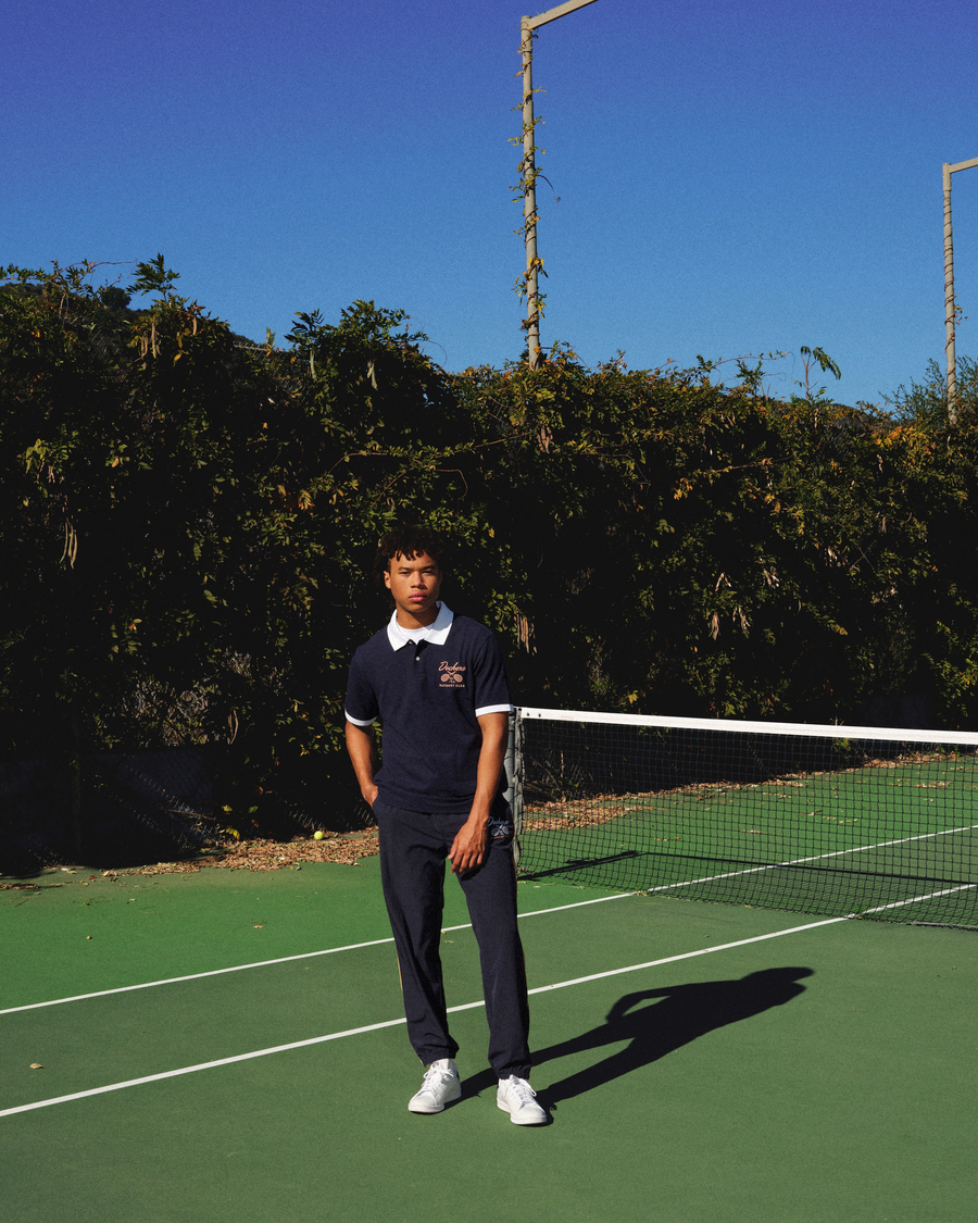View of model wearing Navy Blazer Racquet Club All Court Polo, Regular Fit.