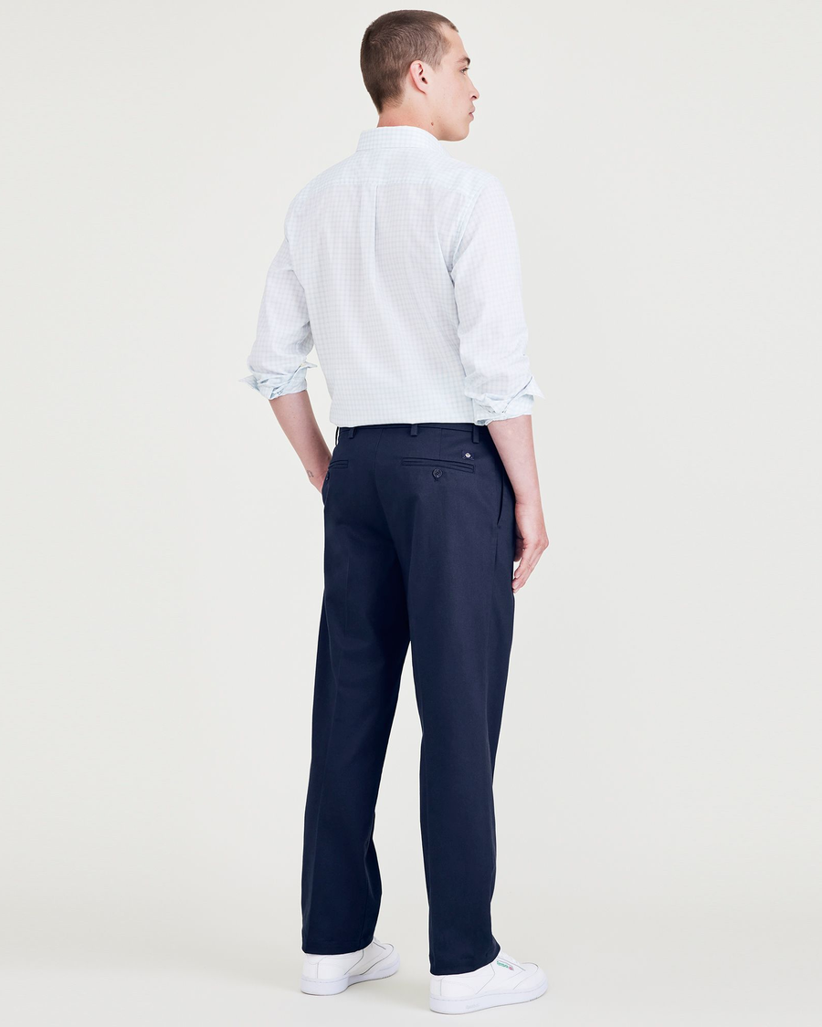 Back view of model wearing Navy Blazer Signature Iron Free Khakis, Pleated, Classic Fit with Stain Defender®.