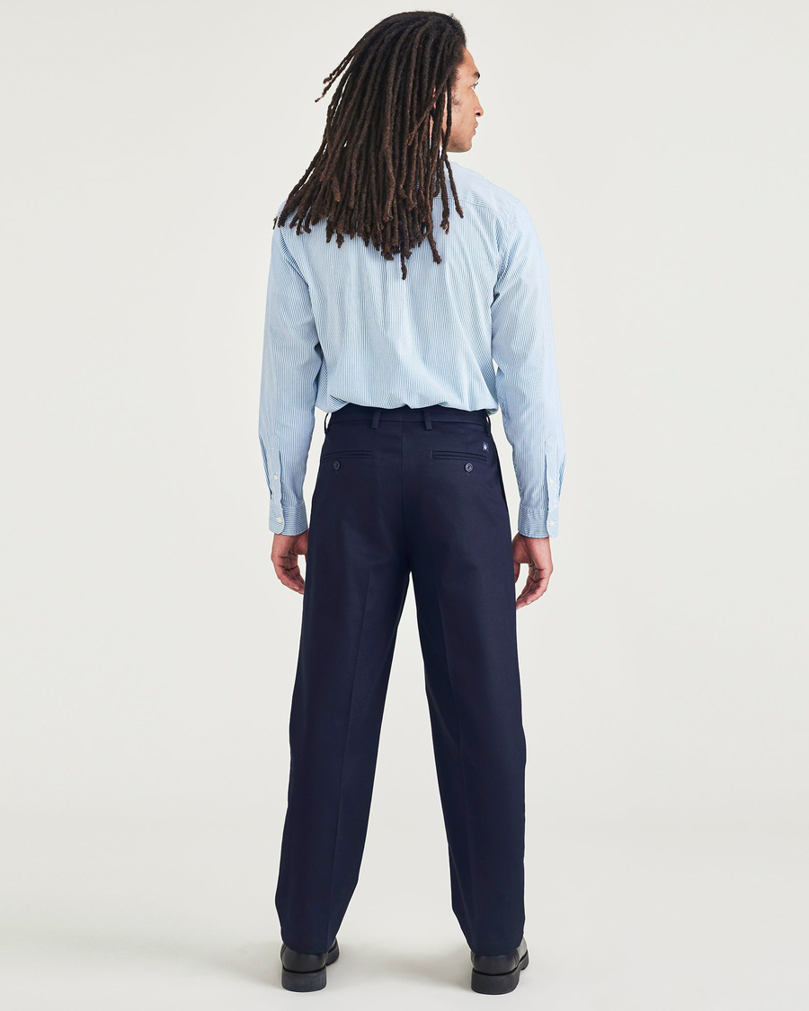 Back view of model wearing Navy Blazer Signature Iron Free Khakis, Pleated, Relaxed Fit with Stain Defender®.