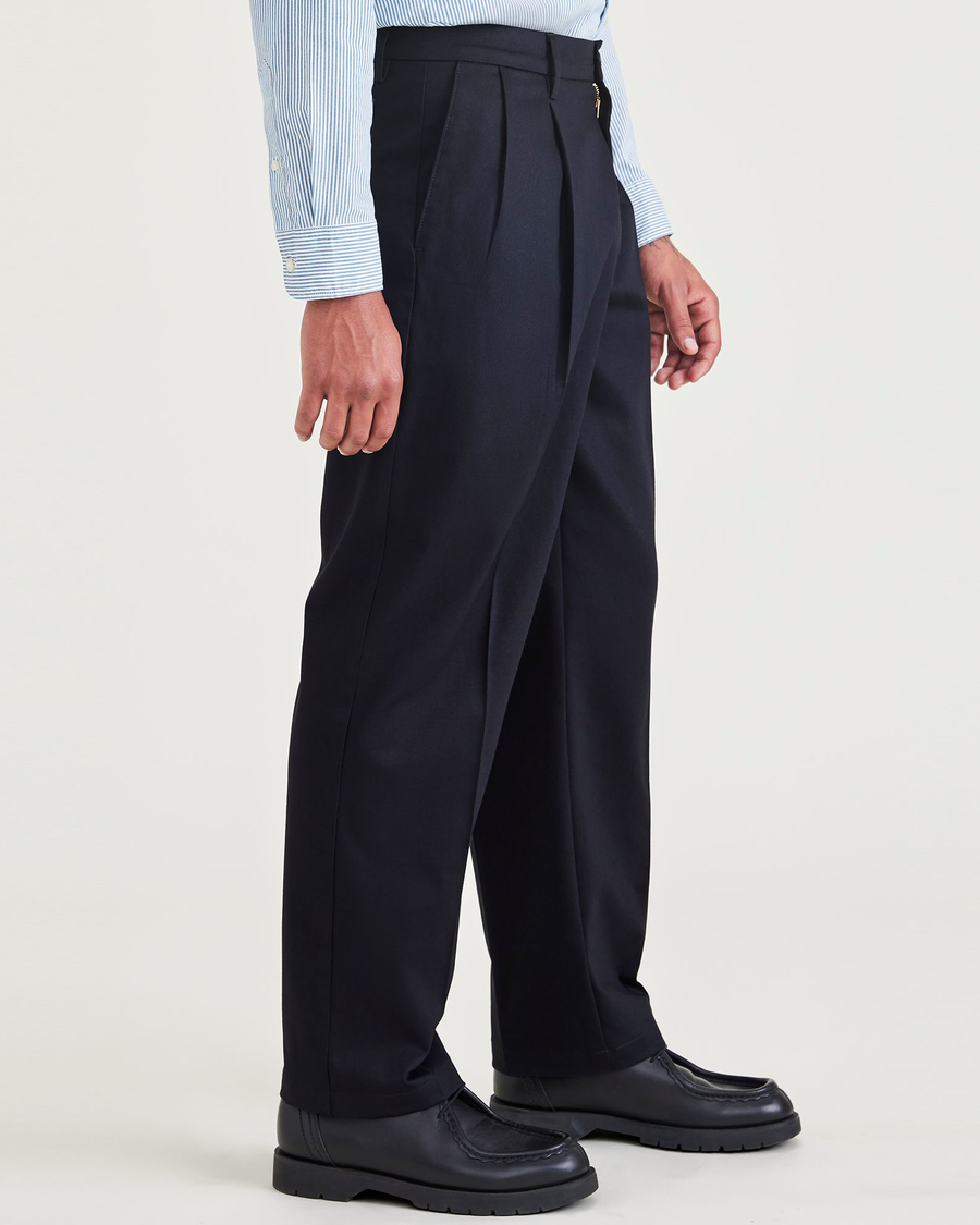 Side view of model wearing Navy Blazer Signature Iron Free Khakis, Pleated, Relaxed Fit with Stain Defender®.