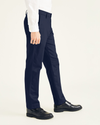 Side view of model wearing Navy Blazer Signature Iron Free Khakis, Slim Fit with Stain Defender®.