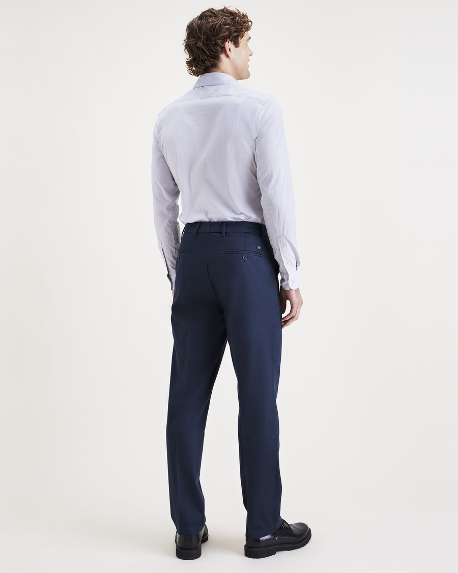 Back view of model wearing Navy Blazer Signature Iron Free Khakis, Straight Fit with Stain Defender®.