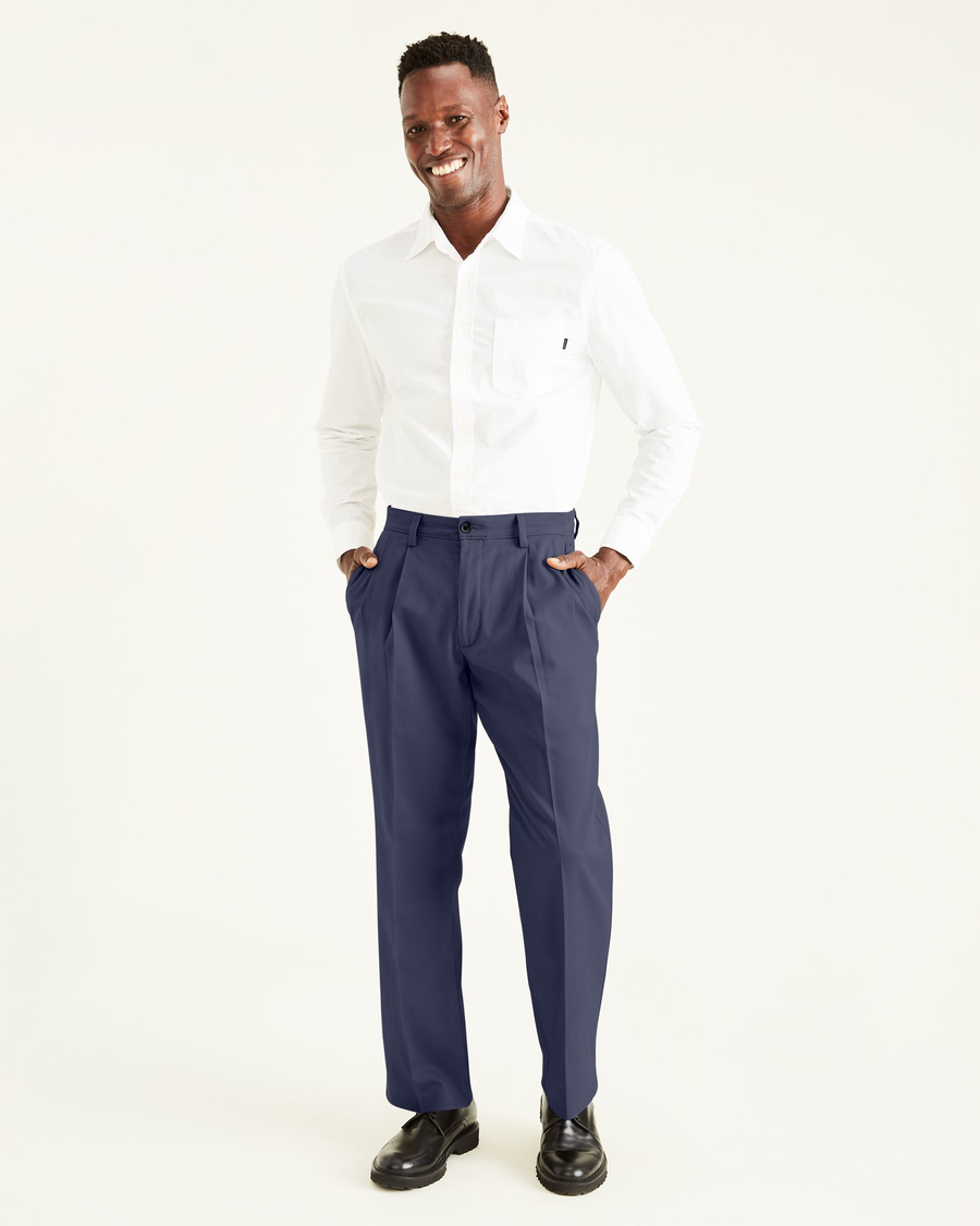 Front view of model wearing Navy Easy Khakis, Pleated, Classic Fit.