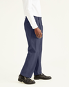 Side view of model wearing Navy Easy Khakis, Pleated, Classic Fit.