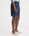 Side view of model wearing Navy Original Pleated 8.5" Short, Classic Fit.