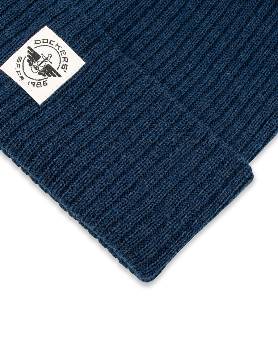 View of  Navy Recycled Double Knit Ribbed Beanie w/ Woven Seasonal Graphic.