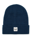 Front view of  Navy Recycled Double Knit Ribbed Beanie w/ Woven Seasonal Graphic.