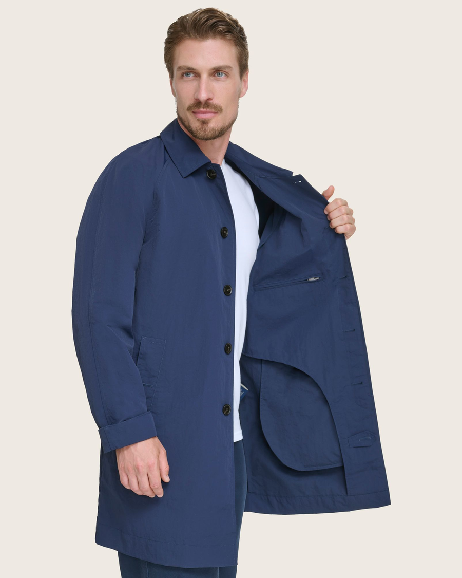 View of model wearing Navy Sail Cloth Trench Coat.