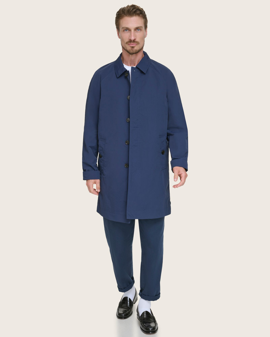 Front view of model wearing Navy Sail Cloth Trench Coat.