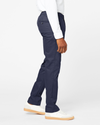 Side view of model wearing Navy Signature Khakis, Athletic Fit.