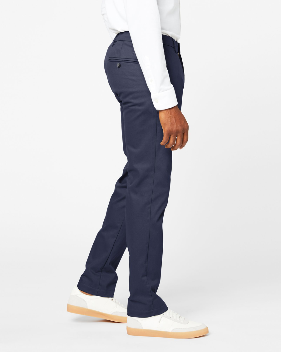 Side view of model wearing Navy Signature Khakis, Athletic Fit.