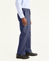 Side view of model wearing Navy Signature Khakis, Classic Fit.