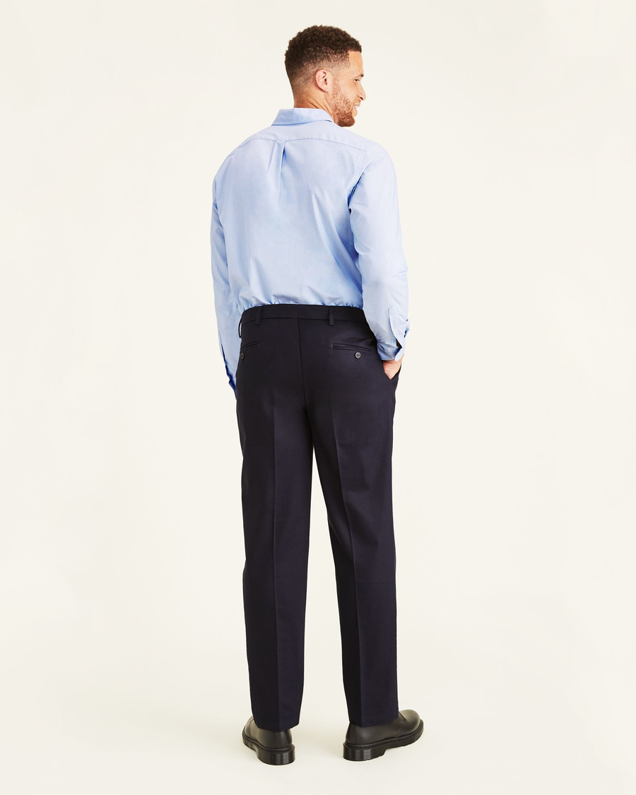 Back view of model wearing Navy Signature Khakis, Pleated, Classic Fit (Big and Tall).