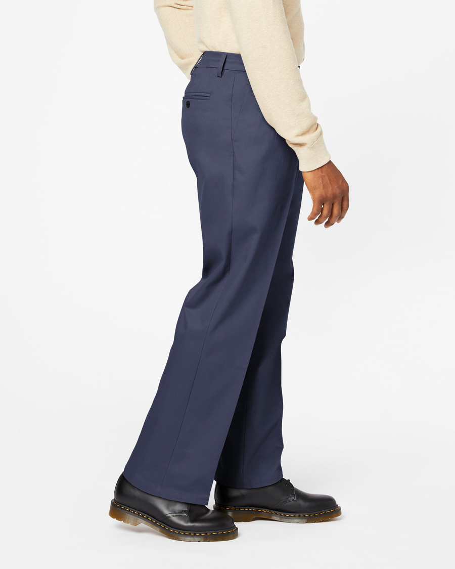 Side view of model wearing Navy Signature Khakis, Pleated, Relaxed Fit.