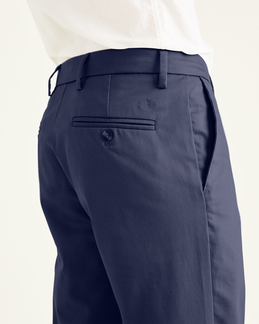 View of model wearing Navy Signature Khakis, Slim Fit.