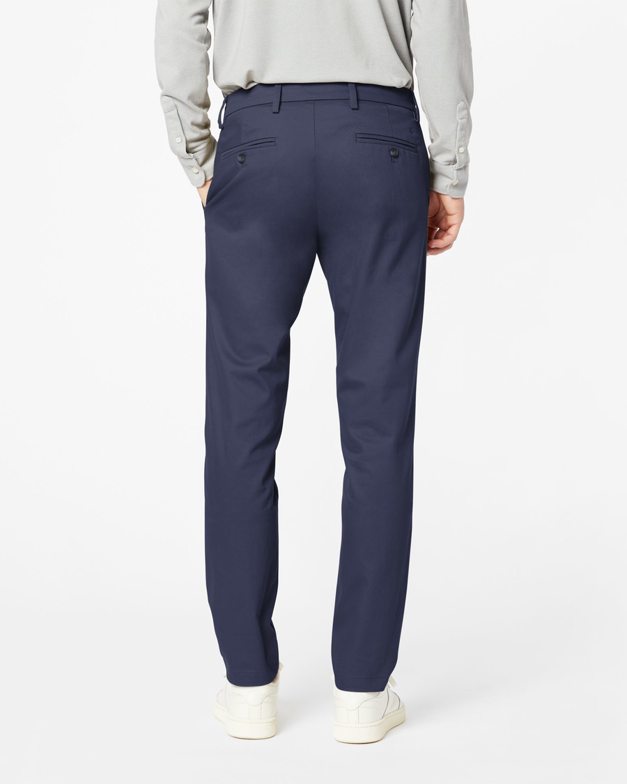 Back view of model wearing Navy Signature Khakis, Slim Fit.