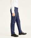 Side view of model wearing Navy Signature Khakis, Slim Fit.