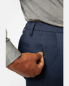 View of model wearing Navy Workday Khakis, Classic Fit.