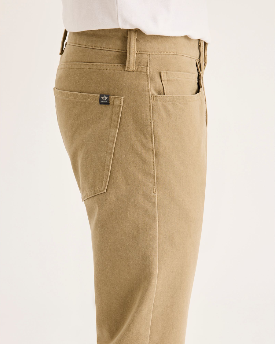 Side view of model wearing New British Khaki All-Day 5-Pocket, Slim Fit.