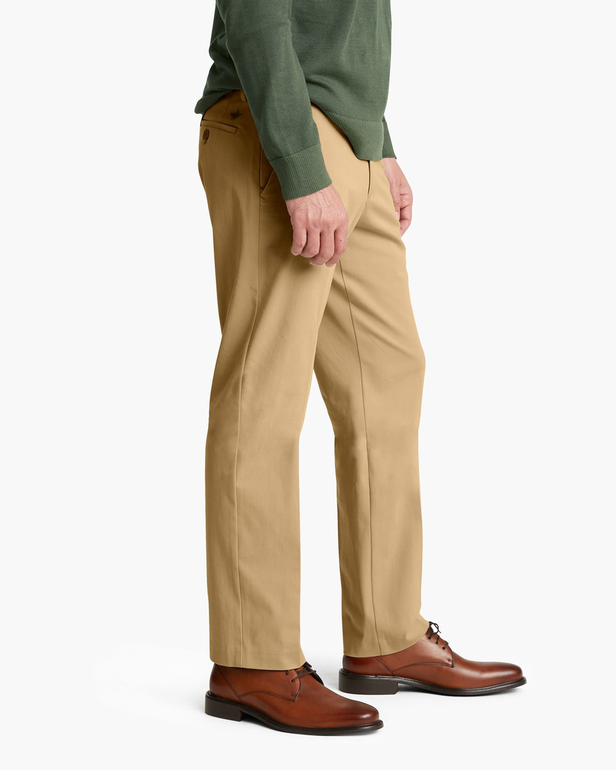 Side view of model wearing New British Khaki City Tech Trousers, Straight Fit.