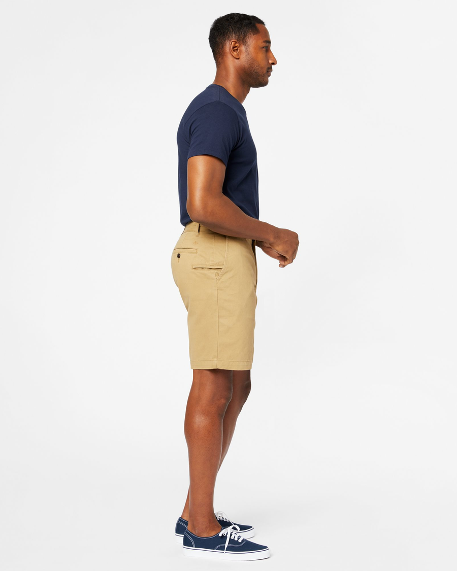 Side view of model wearing New British Khaki Perfect 8" Shorts.
