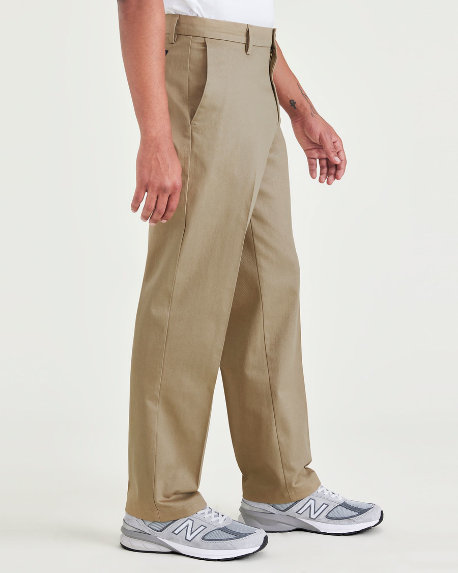 Side view of model wearing New British Khaki Signature Iron Free Khakis, Classic Fit with Stain Defender® (Big and Tall).