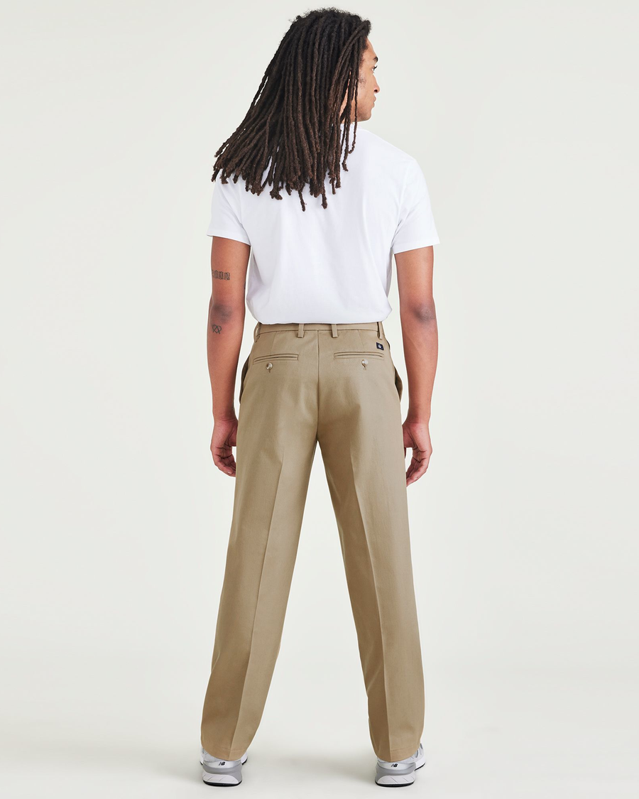 Back view of model wearing New British Khaki Signature Iron Free Khakis, Classic Fit with Stain Defender®.
