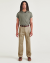 Front view of model wearing New British Khaki Signature Iron Free Khakis, Pleated, Relaxed Fit with Stain Defender®.