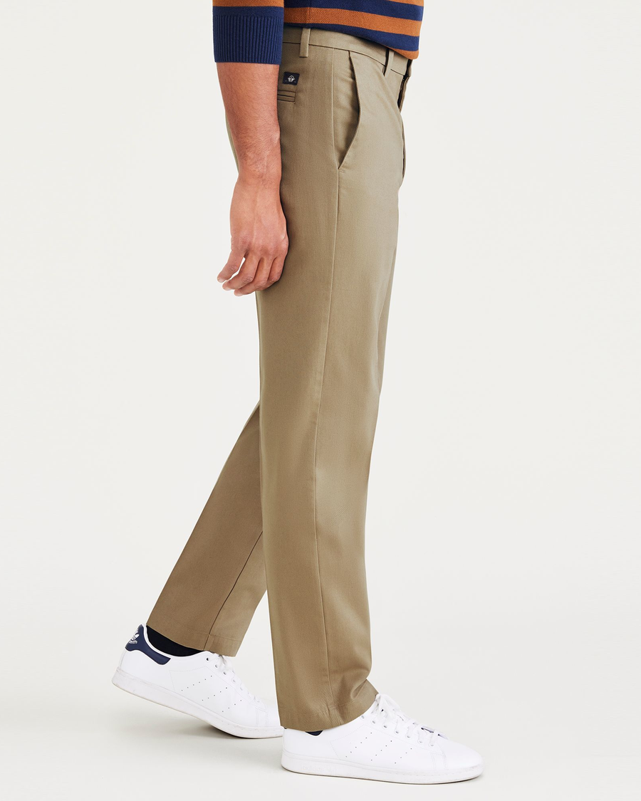Side view of model wearing New British Khaki Signature Iron Free Khakis, Straight Fit with Stain Defender®.