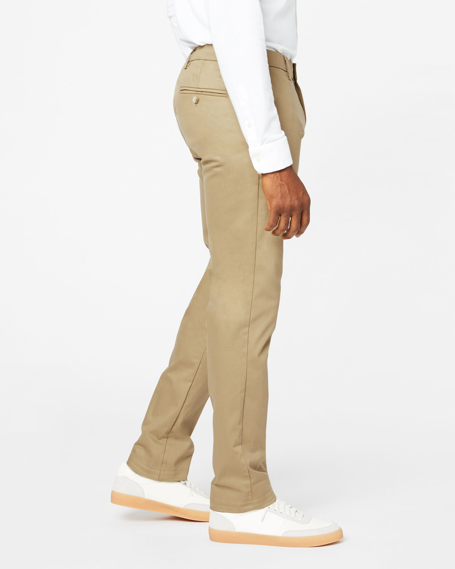 Side view of model wearing New British Khaki Signature Khakis, Athletic Fit.