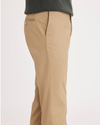 Side view of model wearing New British Khaki Signature Khakis, Slim Fit.