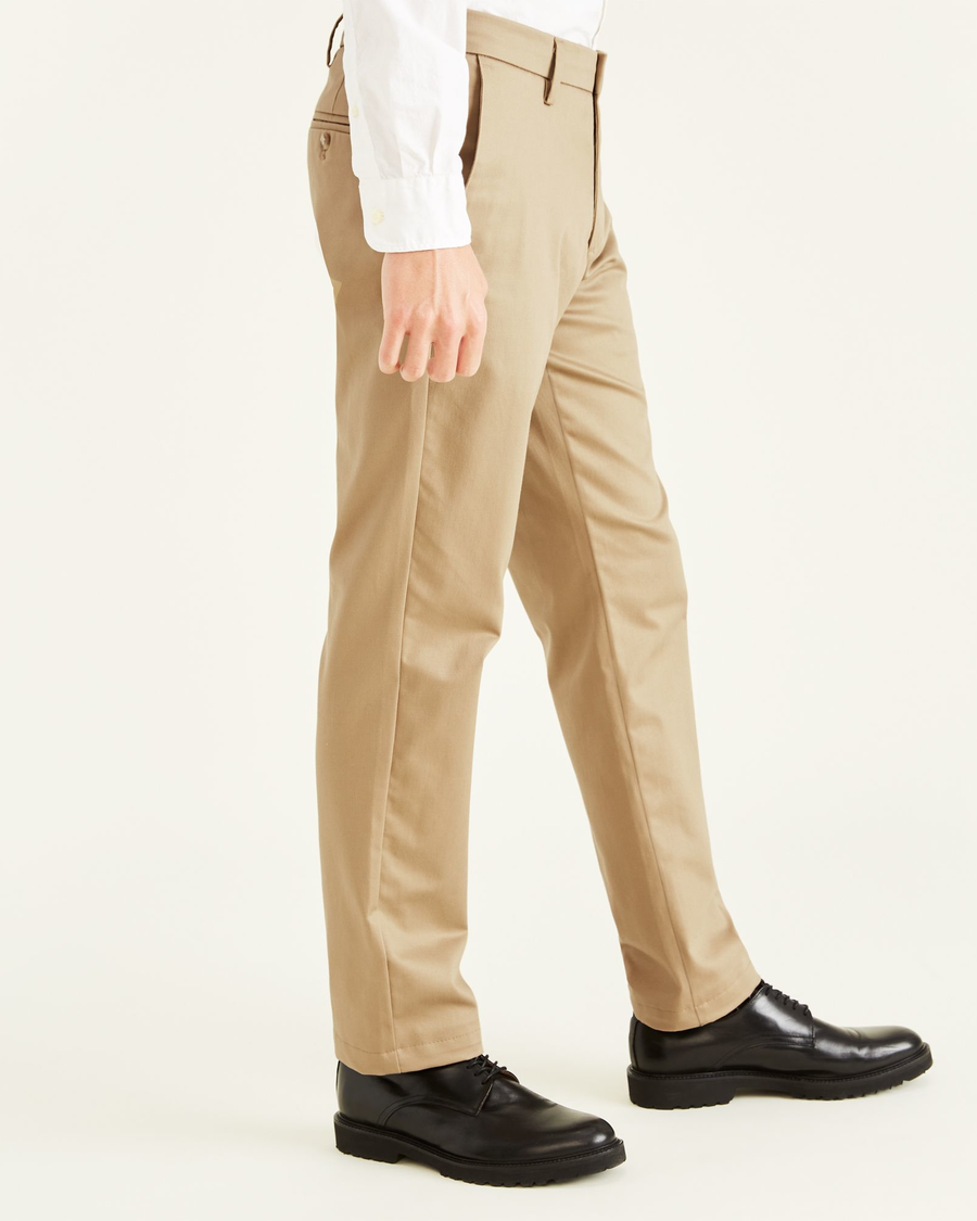 Side view of model wearing New British Khaki Signature Khakis, Slim Fit.