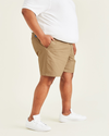 Side view of model wearing New British Khaki Ultimate 9.5" Shorts (Big and Tall).