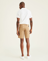 Back view of model wearing New British Khaki Ultimate 9.5" Shorts, Straight Fit.
