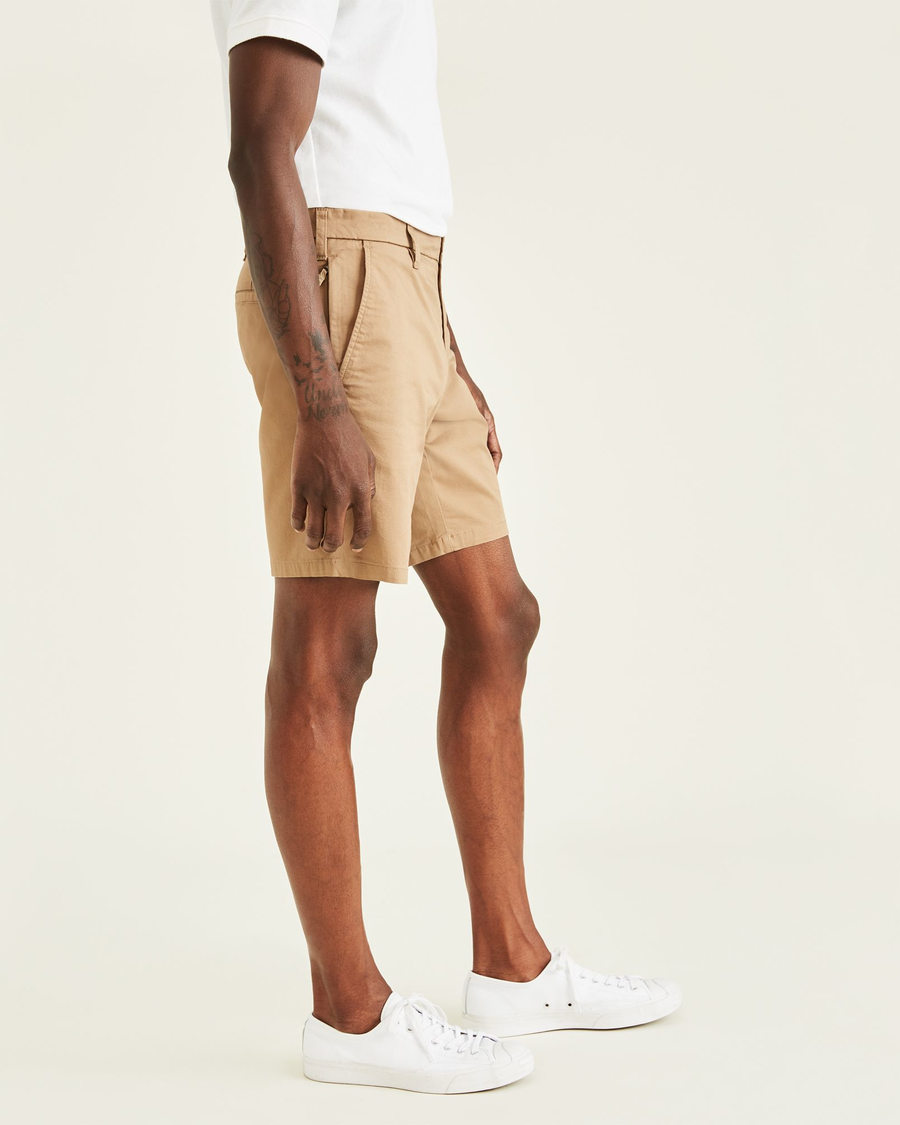 Side view of model wearing New British Khaki Ultimate 9.5" Shorts, Straight Fit.