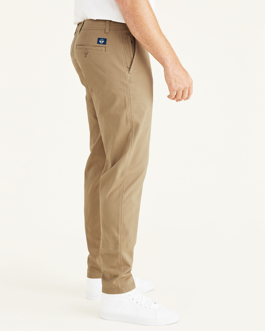 Side view of model wearing New British Khaki Ultimate Chinos, Athletic Fit (Big and Tall).