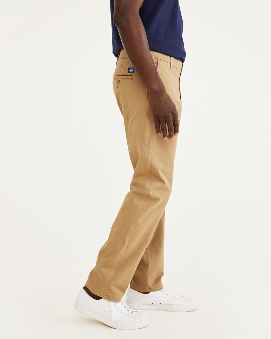 Side view of model wearing New British Khaki Ultimate Chinos, Athletic Fit.